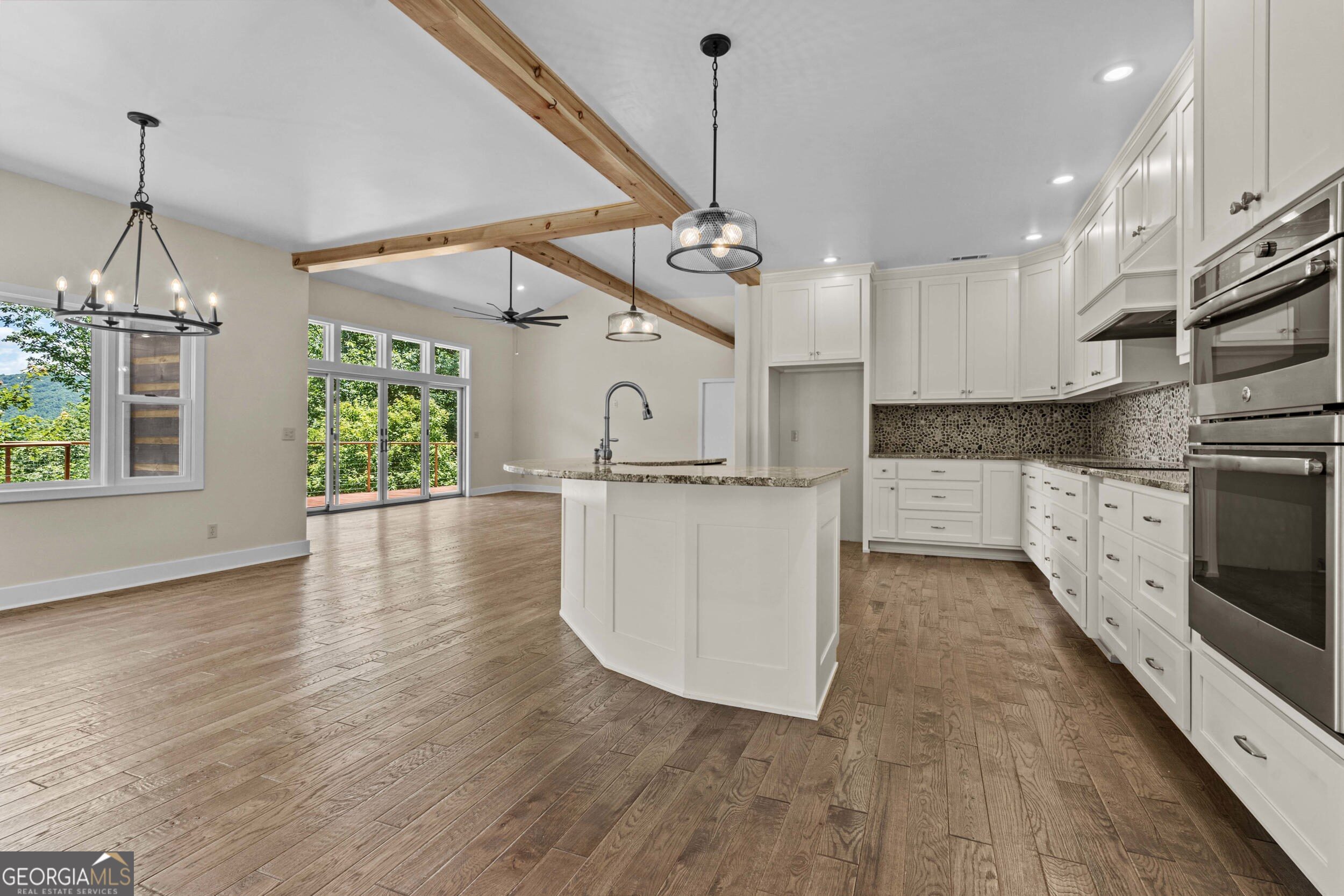 420 Hidden Acres Lane Clayton, GA 30525 - Photo 14 of 46 a view of a kitchen with furniture and wooden floor