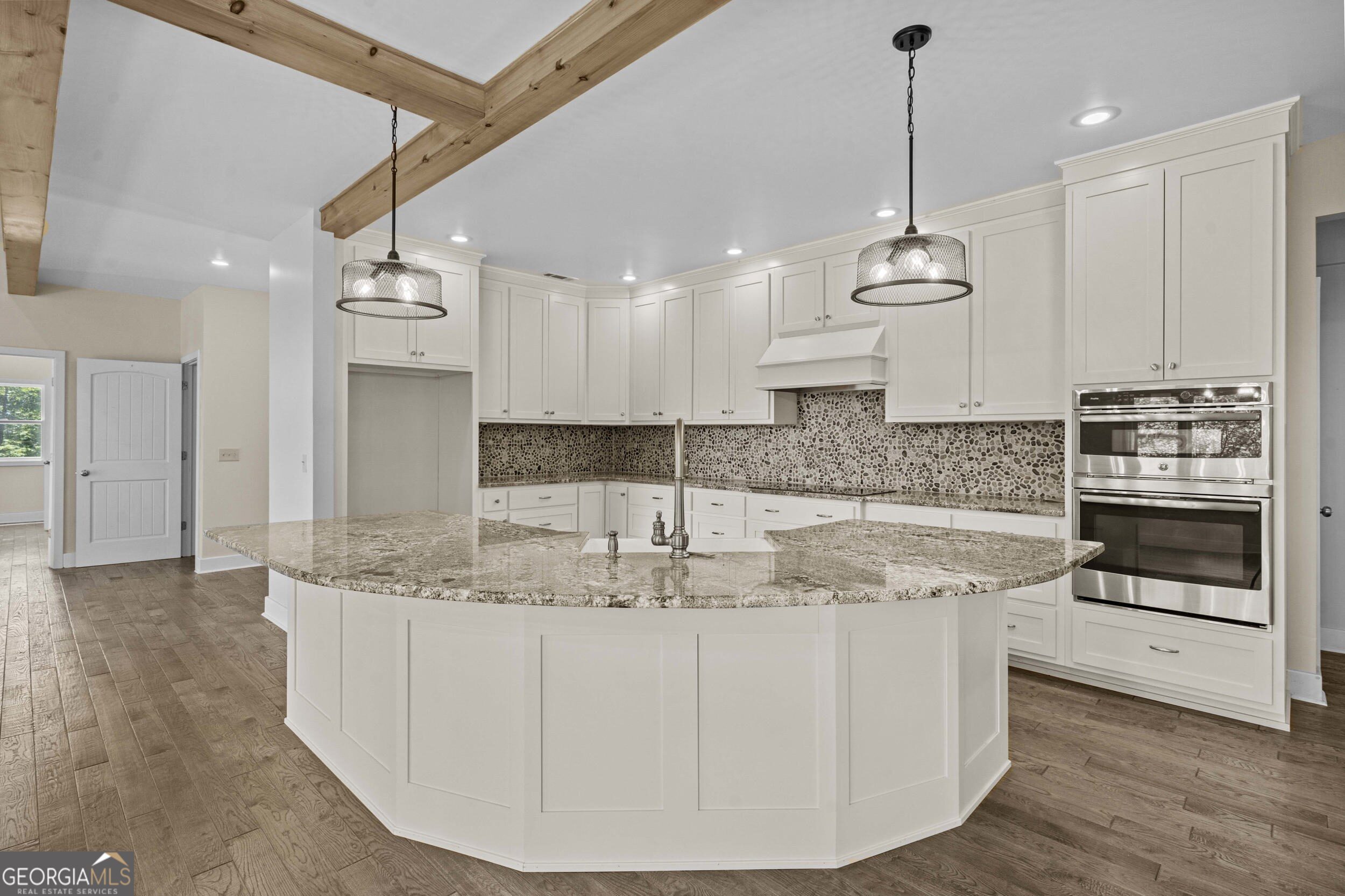 420 Hidden Acres Lane Clayton, GA 30525 - Photo 15 of 46 a kitchen with kitchen island granite countertop a sink stainless steel appliances and cabinets