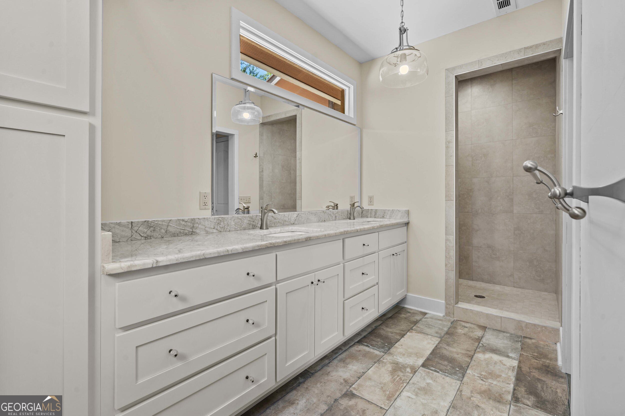 420 Hidden Acres Lane Clayton, GA 30525 - Photo 24 of 46 a bathroom with a granite countertop sink mirror and shower