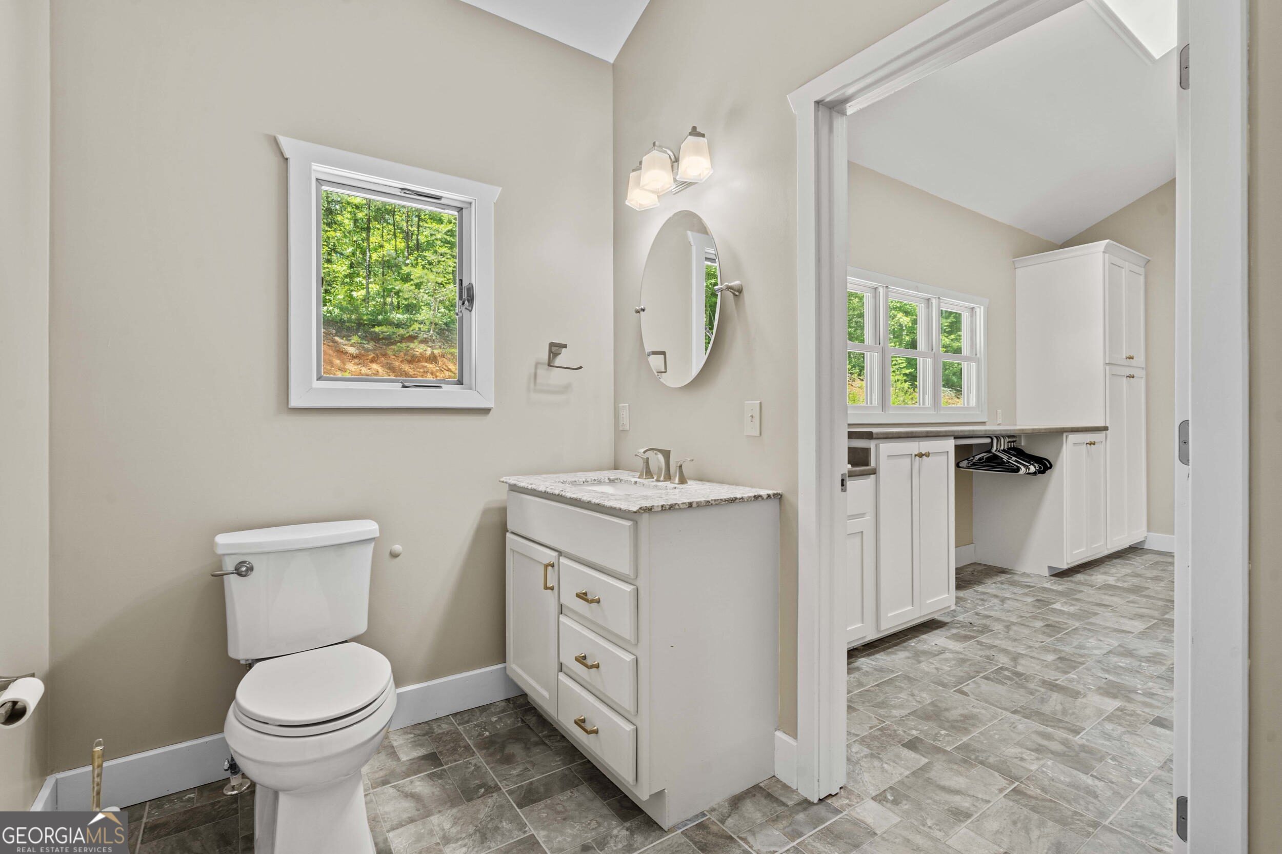 420 Hidden Acres Lane Clayton, GA 30525 - Photo 26 of 46 a bathroom with a toilet sink and mirror