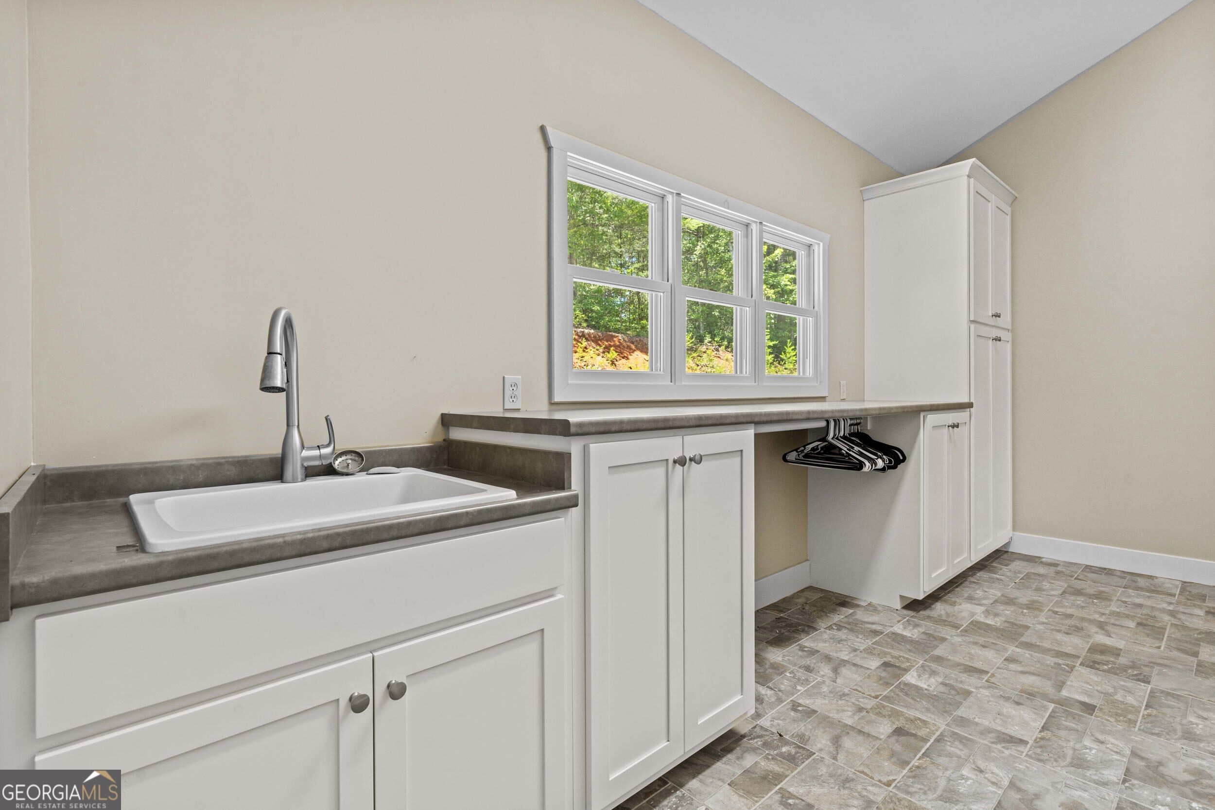 420 Hidden Acres Lane Clayton, GA 30525 - Photo 27 of 46 a bathroom with a sink and a window