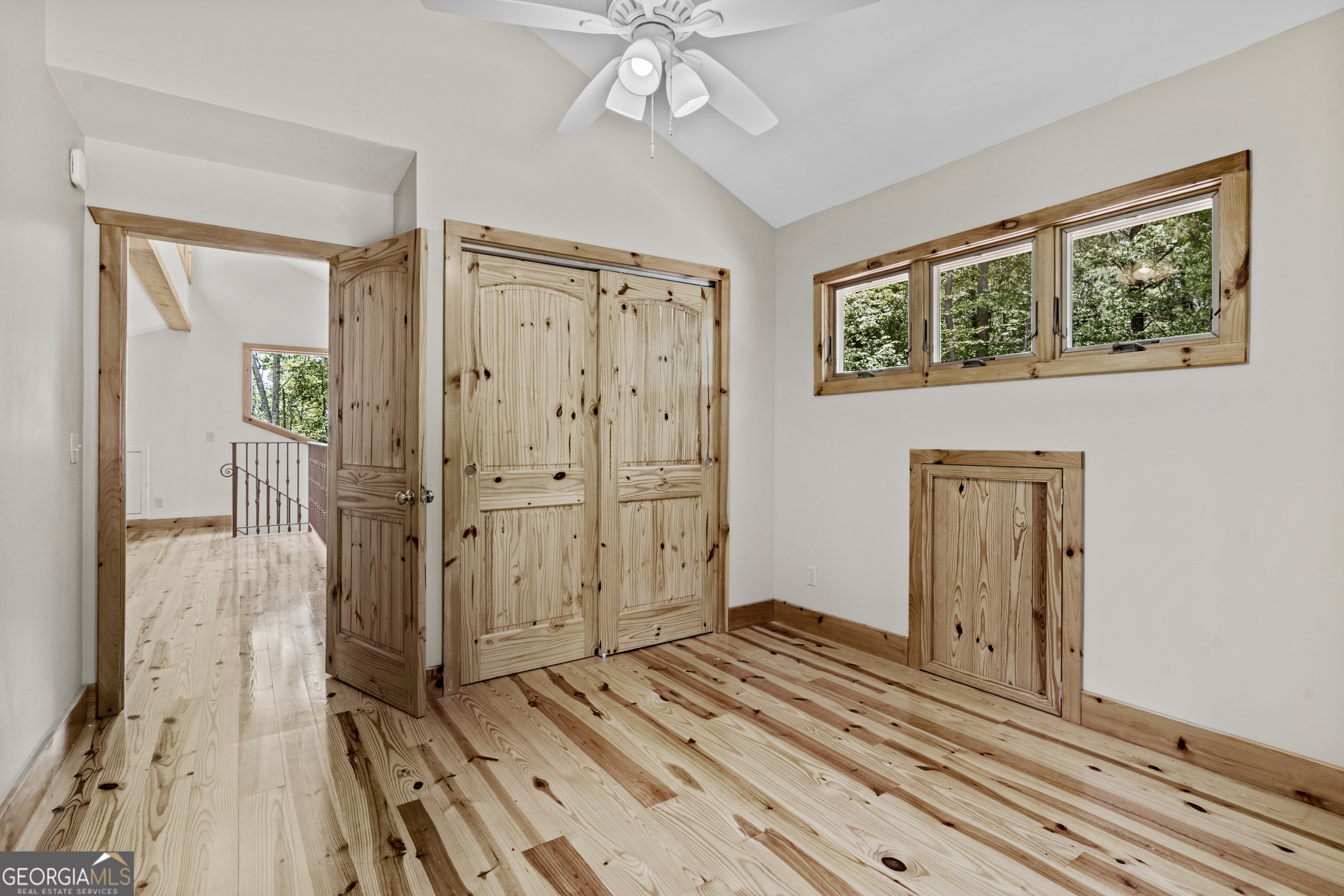 420 Hidden Acres Lane Clayton, GA 30525 - Photo 33 of 46 a view of a livingroom with wooden floor and a ceiling fan