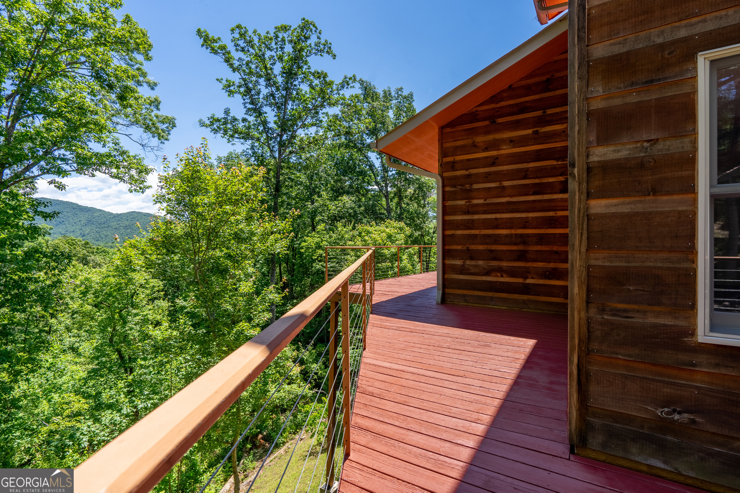 420 Hidden Acres Lane Clayton, GA 30525 - Photo 41 of 46 a balcony with view of stairs and wooden floor