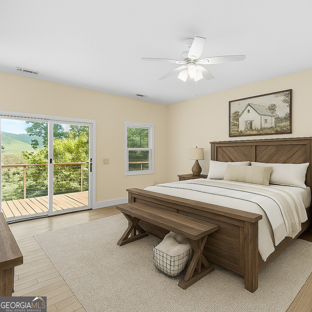 420 Hidden Acres Lane Clayton, GA 30525 - Photo 5 of 46 a spacious bedroom with a bed and a window