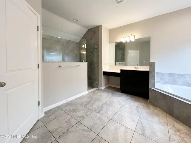 a white toilet sitting next to a white wall