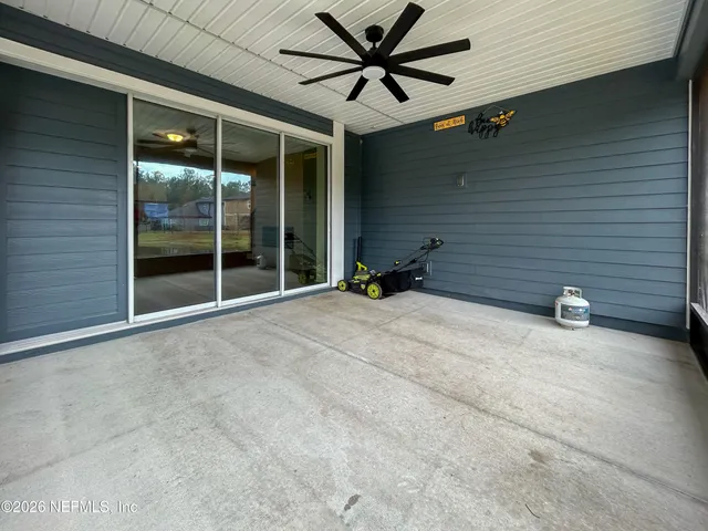 a view of a lake with houses in the back