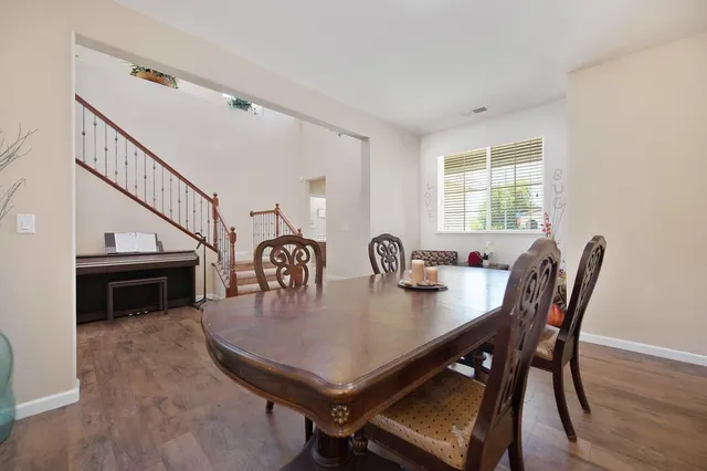 a view of a dining room and livingroom with furniture
