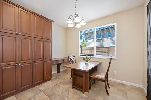 a dining room with furniture and window