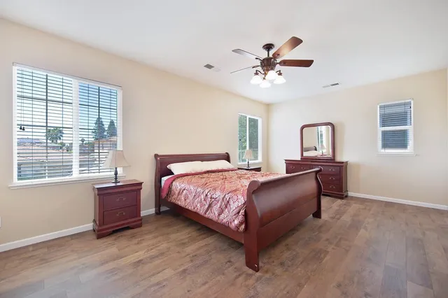 a bedroom with a bed and window