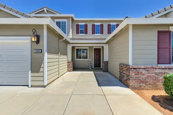 a view of house and entrance gate