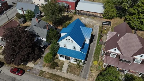 an aerial view of houses with outdoor space