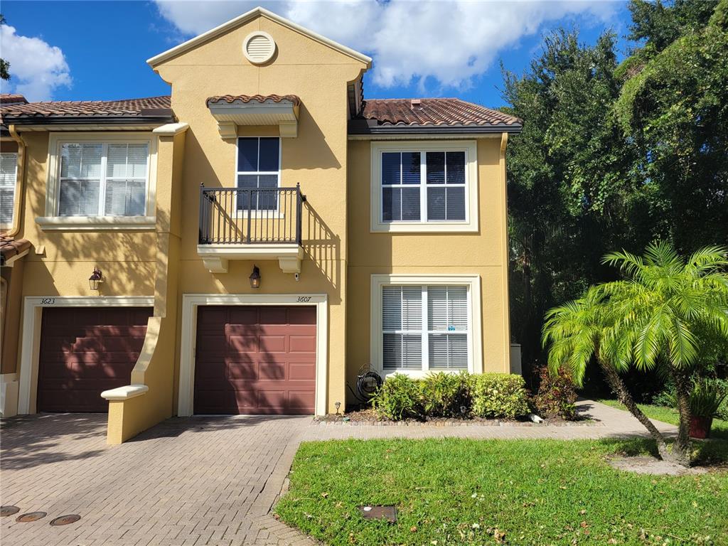 3607 Zuma Way Orlando, FL 32839 - Photo 1 of 1 a front view of a house with a yard and garage