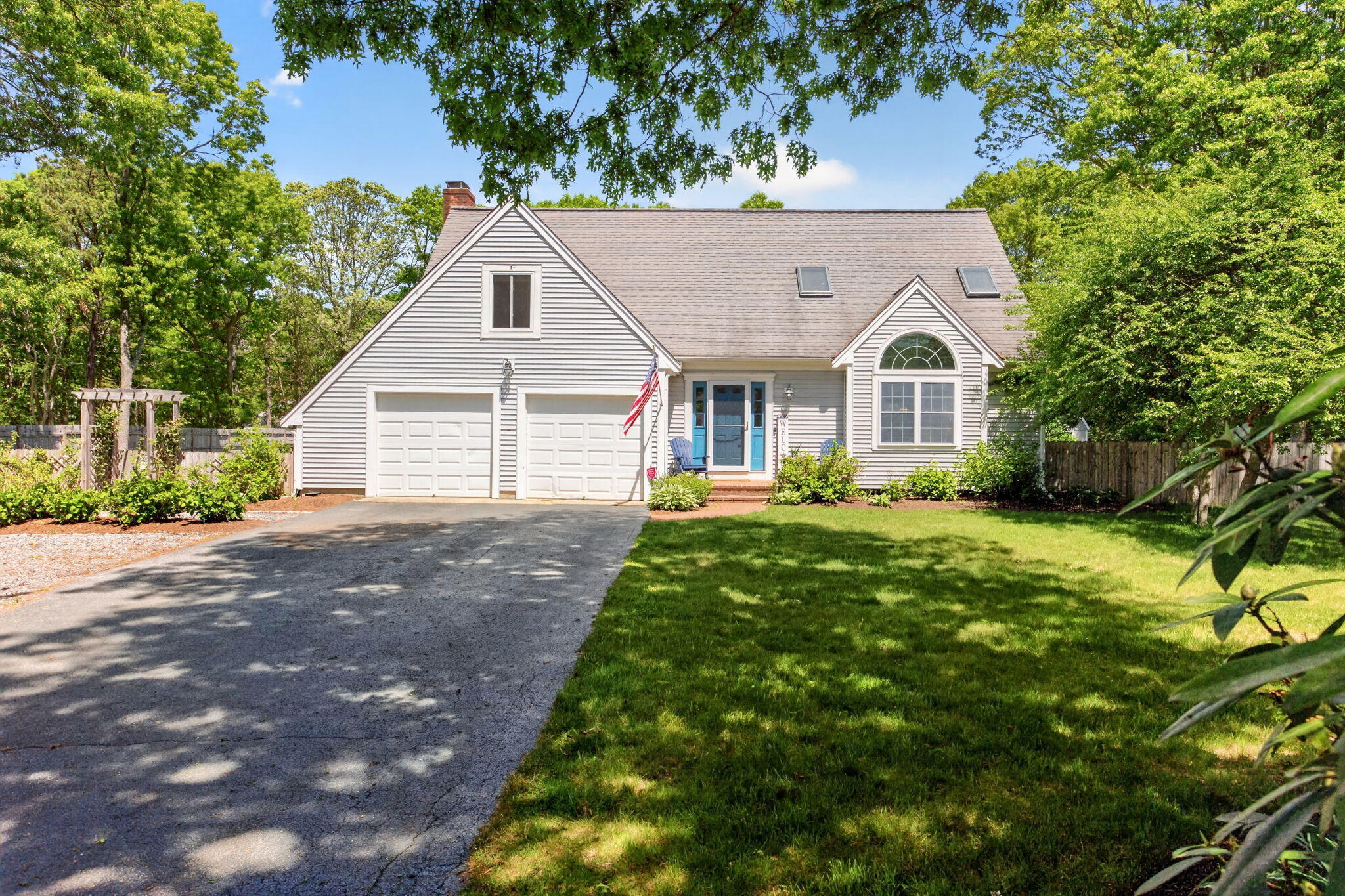 12 Sarah Lawrence Road Sandwich, MA 02563 - Photo 1 of 54 a front view of a house with garden