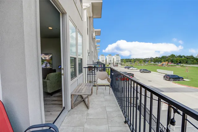 a view of a balcony with city view