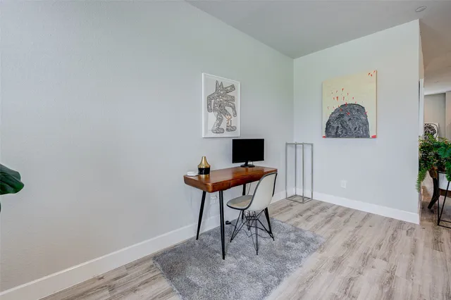 a workspace with furniture and a window