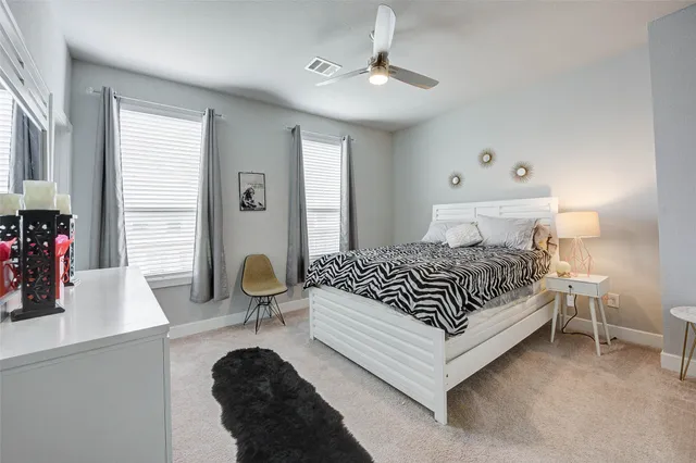 a bedroom with a bed and window