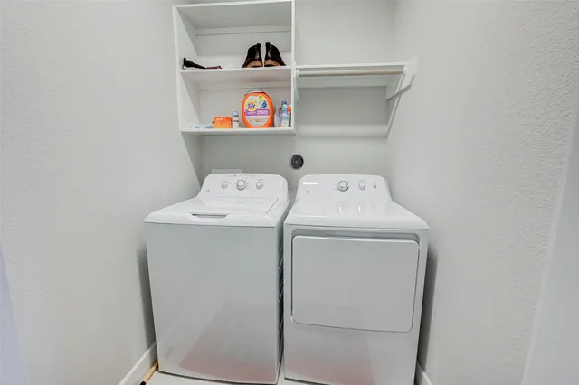 a bedroom with a bed and a television