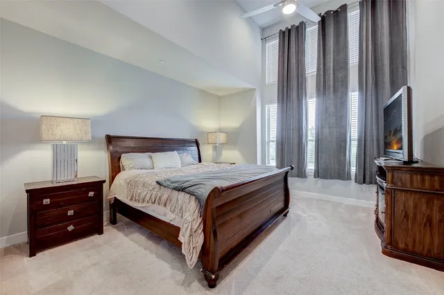 a bedroom with a bed and a night stand