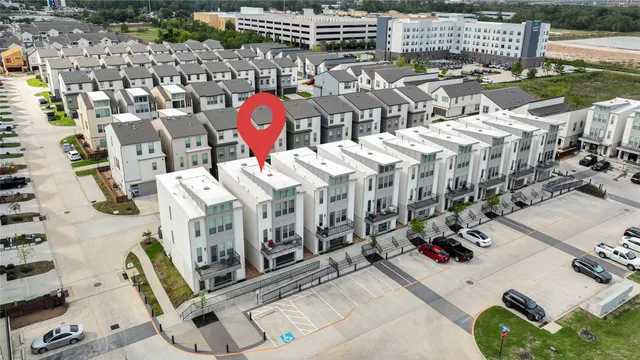 a view of a hallway to a dining room with a table and chairs