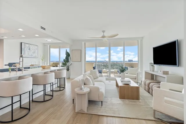 a living room with fireplace furniture and a flat screen tv