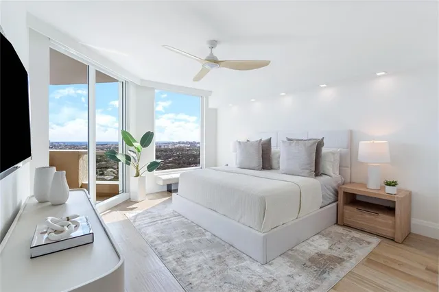 a bedroom with a large bed and a couch