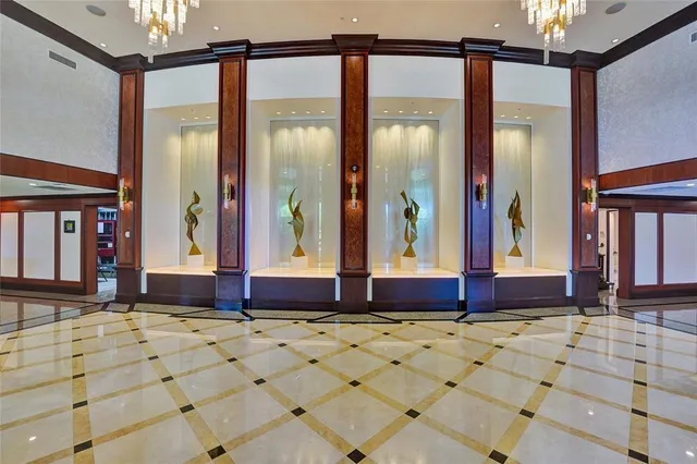 a view of a living room with furniture and a wooden floor
