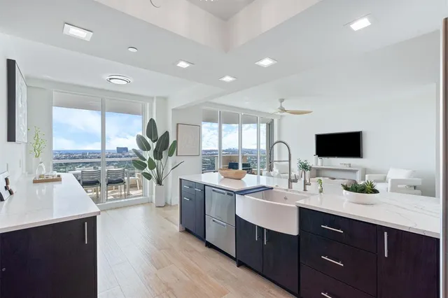 a kitchen with a sink stove and cabinets