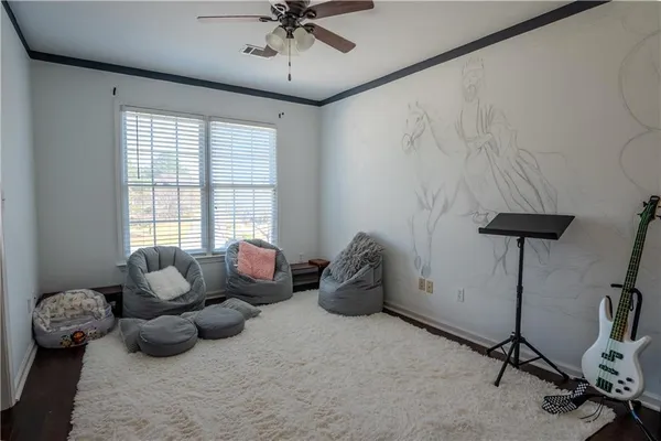 a room with lots of chairs and a chandelier