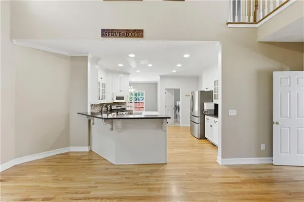 a view of walk in closet with clothes