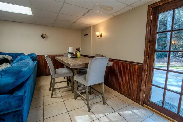 a view of a dining room with furniture and window
