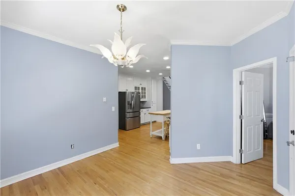 a kitchen with stainless steel appliances a refrigerator sink and microwave