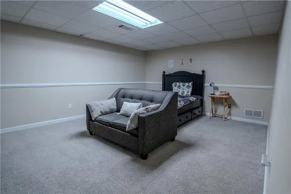a living room with furniture and a couch