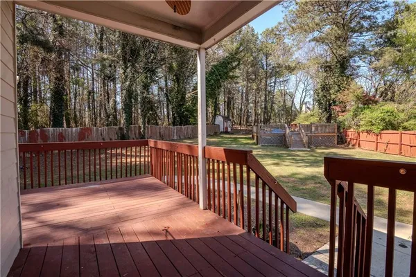 a view of deck with wooden floor and outdoor seating