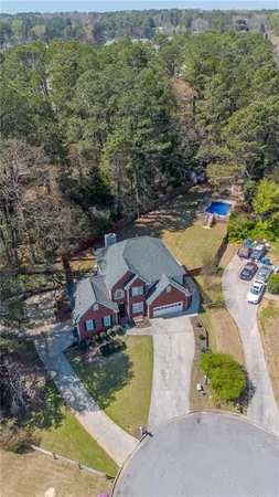 an aerial view of a house with a garden
