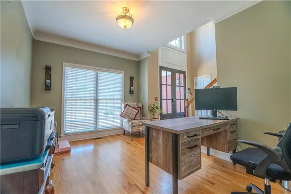 a workspace with furniture and wooden floor