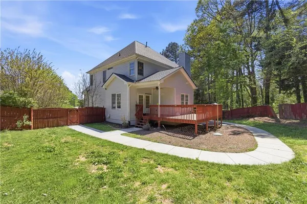 a kitchen with stainless steel appliances granite countertop a sink refrigerator and a stove