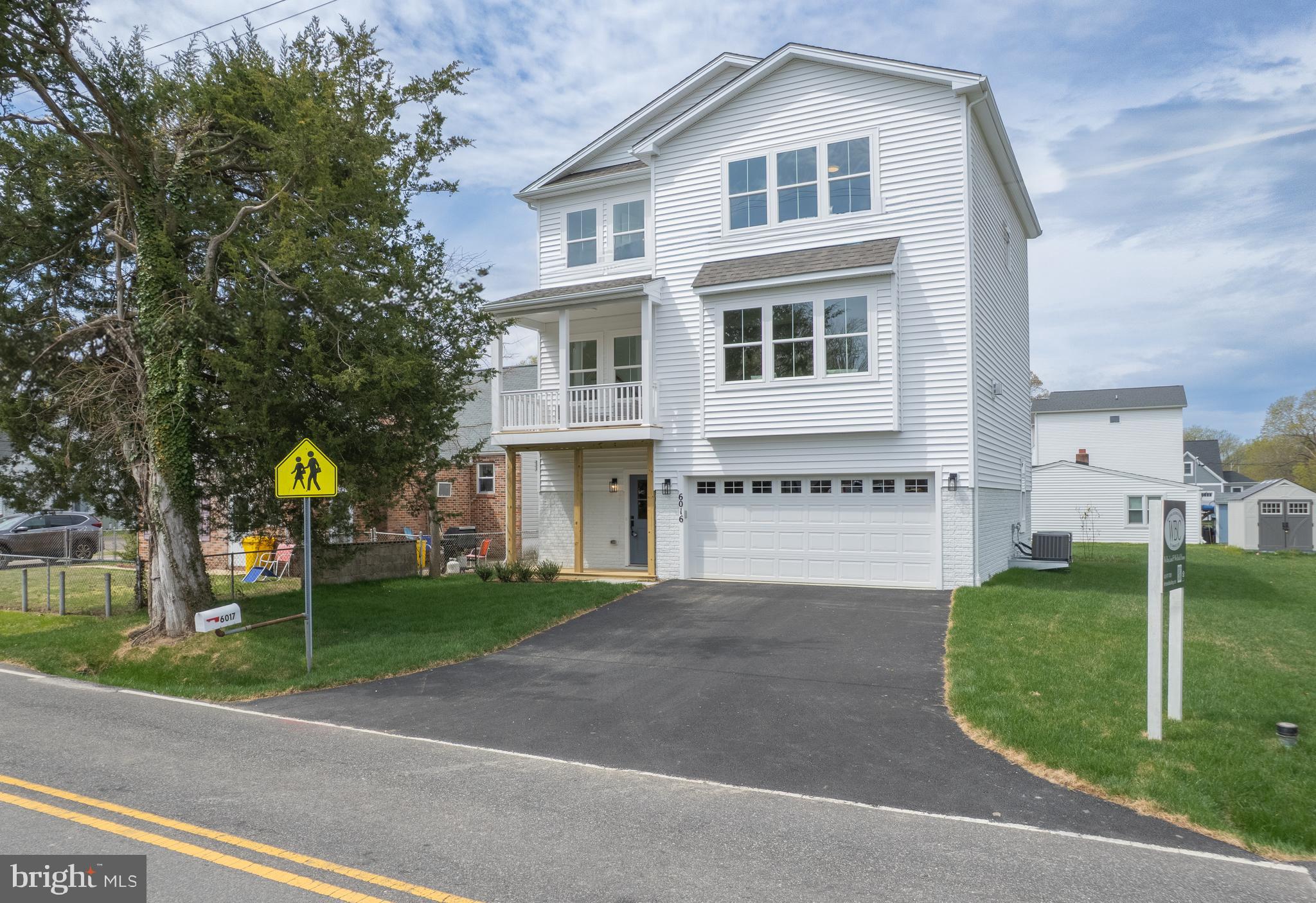 6016 Drum Point Road Deale, MD 20751 - Photo 1 of 42 a front view of a house with a garden