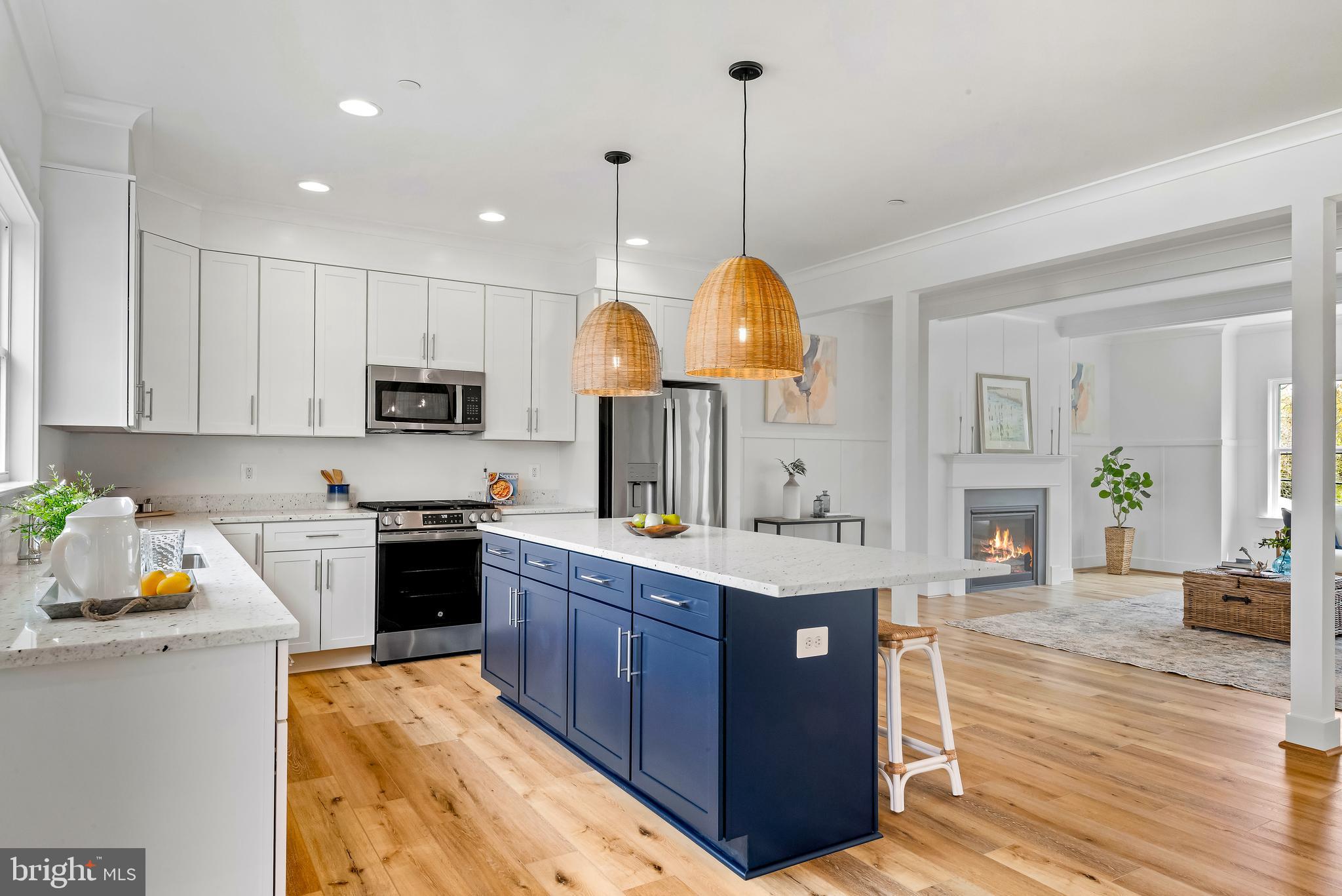 6016 Drum Point Road Deale, MD 20751 - Photo 11 of 42 a kitchen with stainless steel appliances granite countertop a stove refrigerator and cabinets