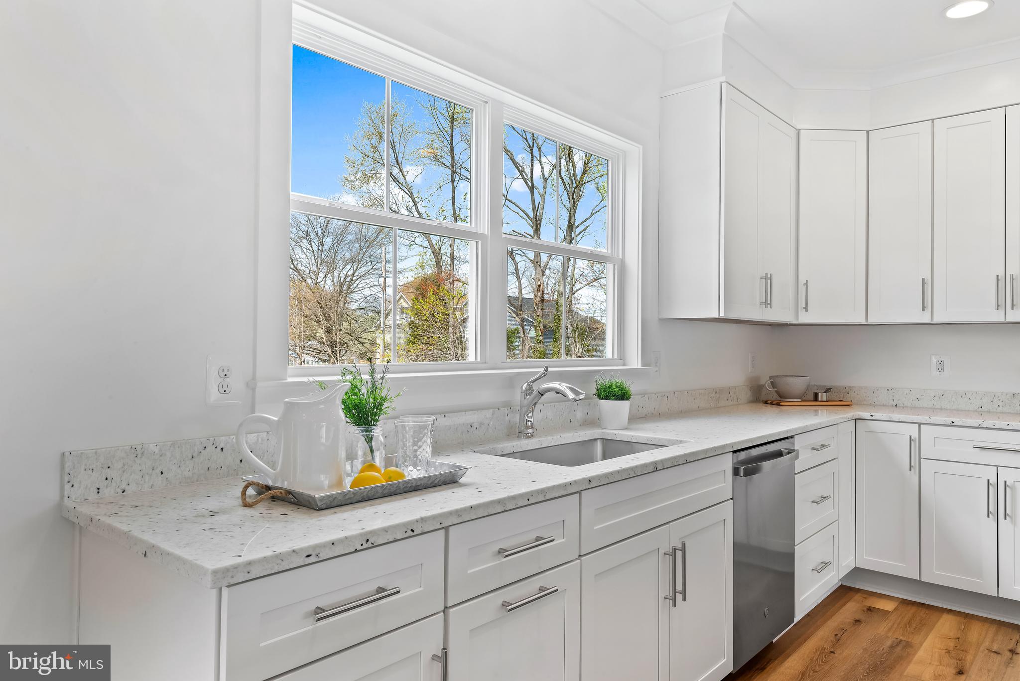 6016 Drum Point Road Deale, MD 20751 - Photo 12 of 42 a kitchen with a sink and cabinets