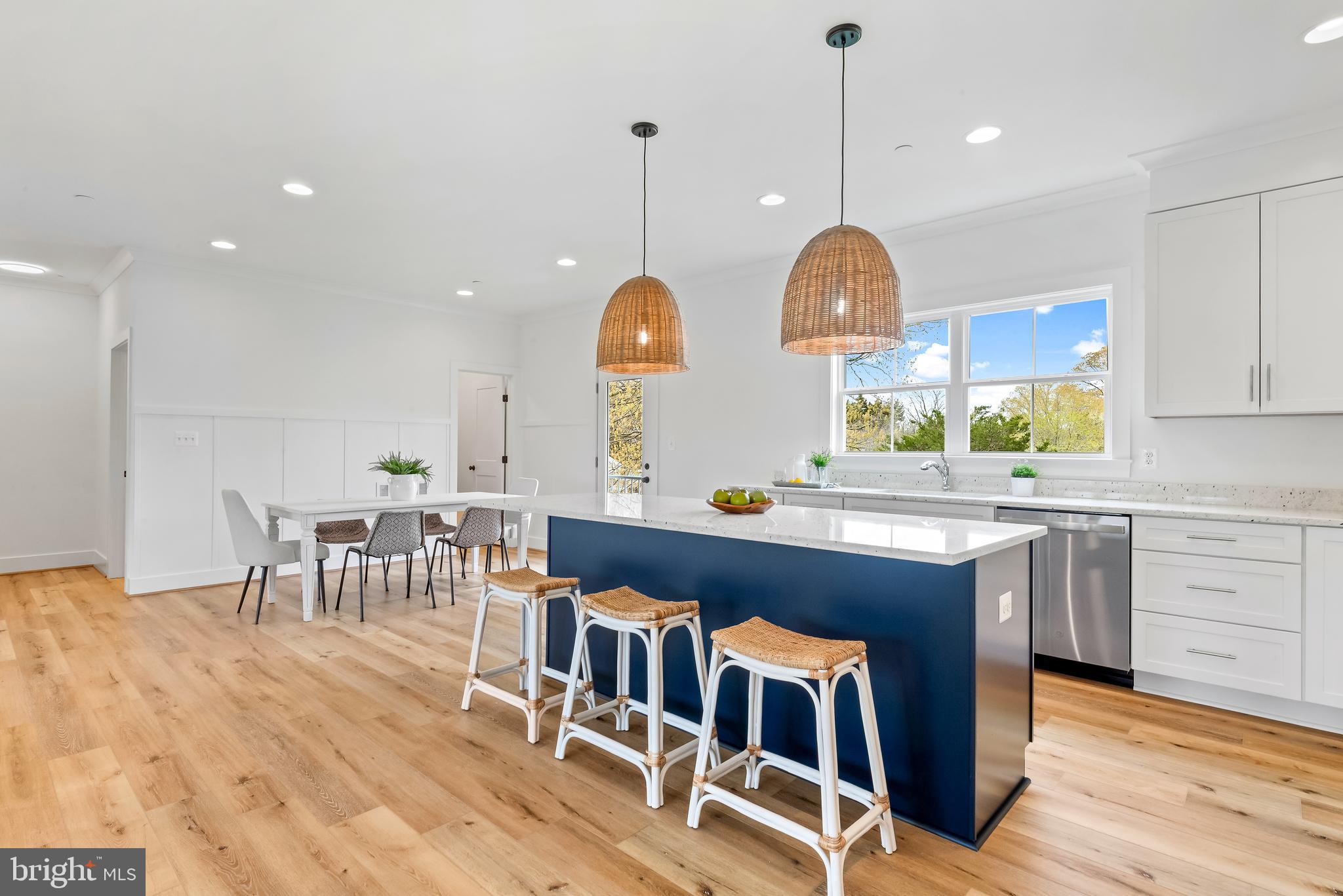 6016 Drum Point Road Deale, MD 20751 - Photo 14 of 42 a living room with furniture a table and kitchen chandelier
