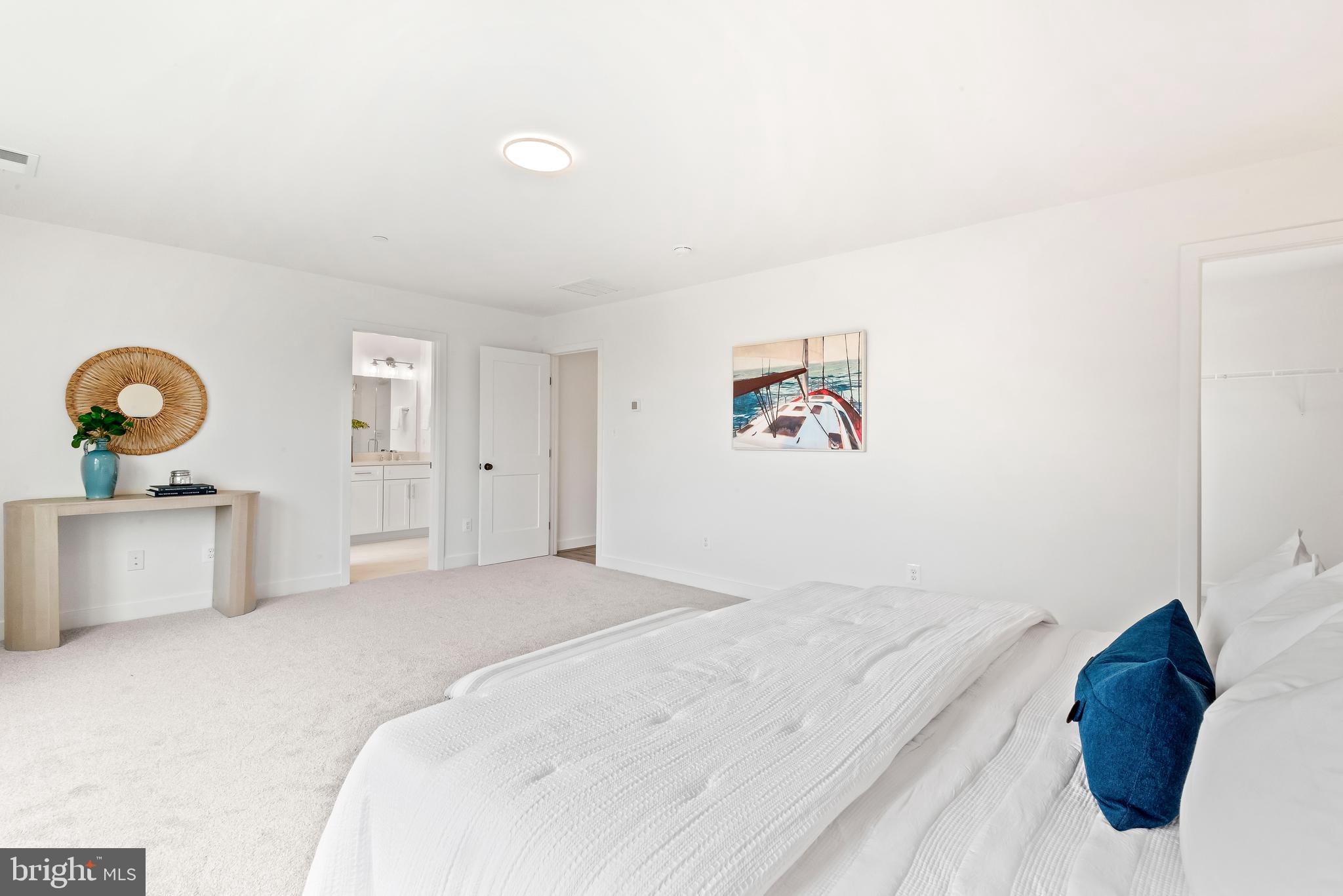 6016 Drum Point Road Deale, MD 20751 - Photo 26 of 42 a bedroom with a bed and painting on the wall