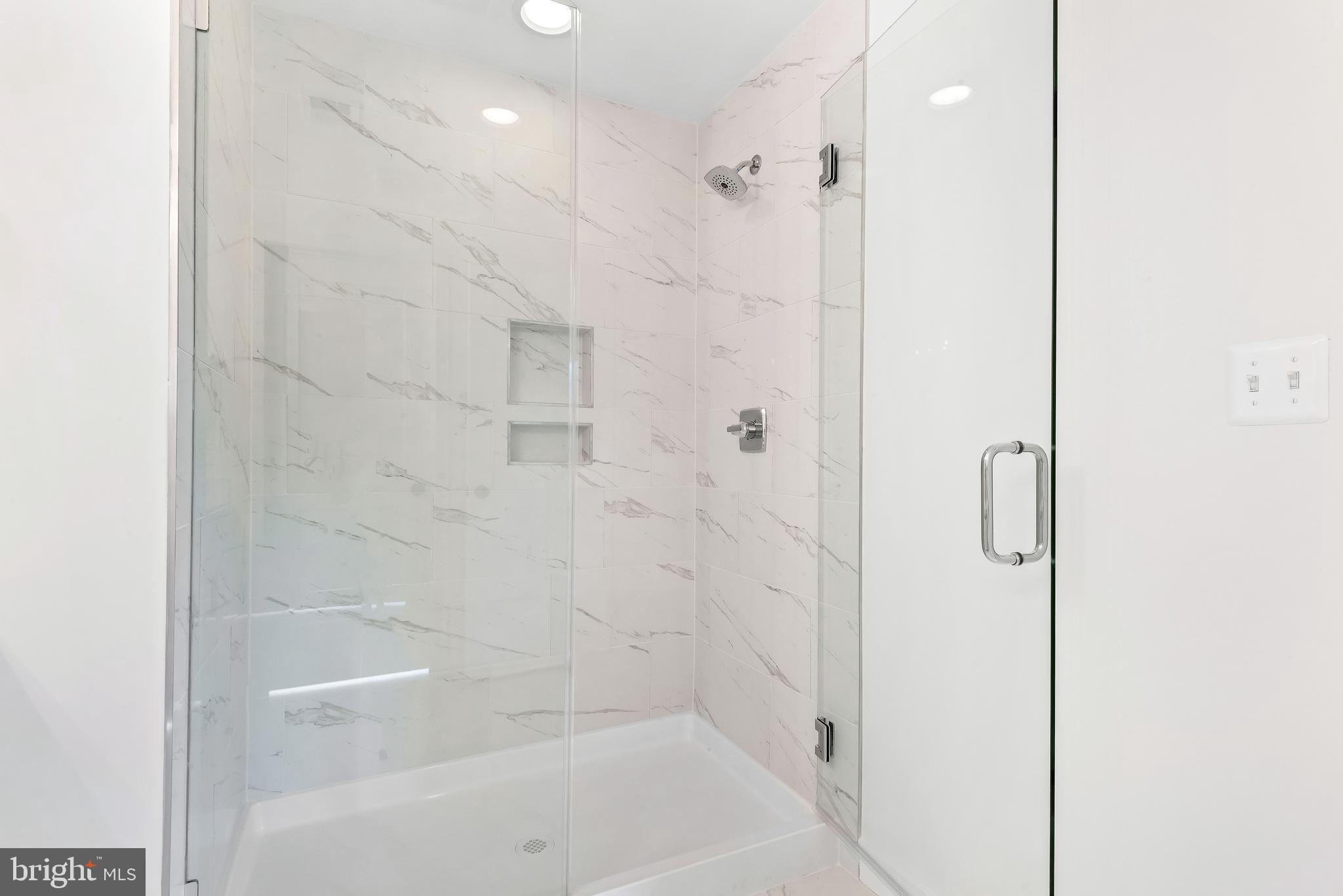 6016 Drum Point Road Deale, MD 20751 - Photo 30 of 42 a bathroom with a bathtub and shower