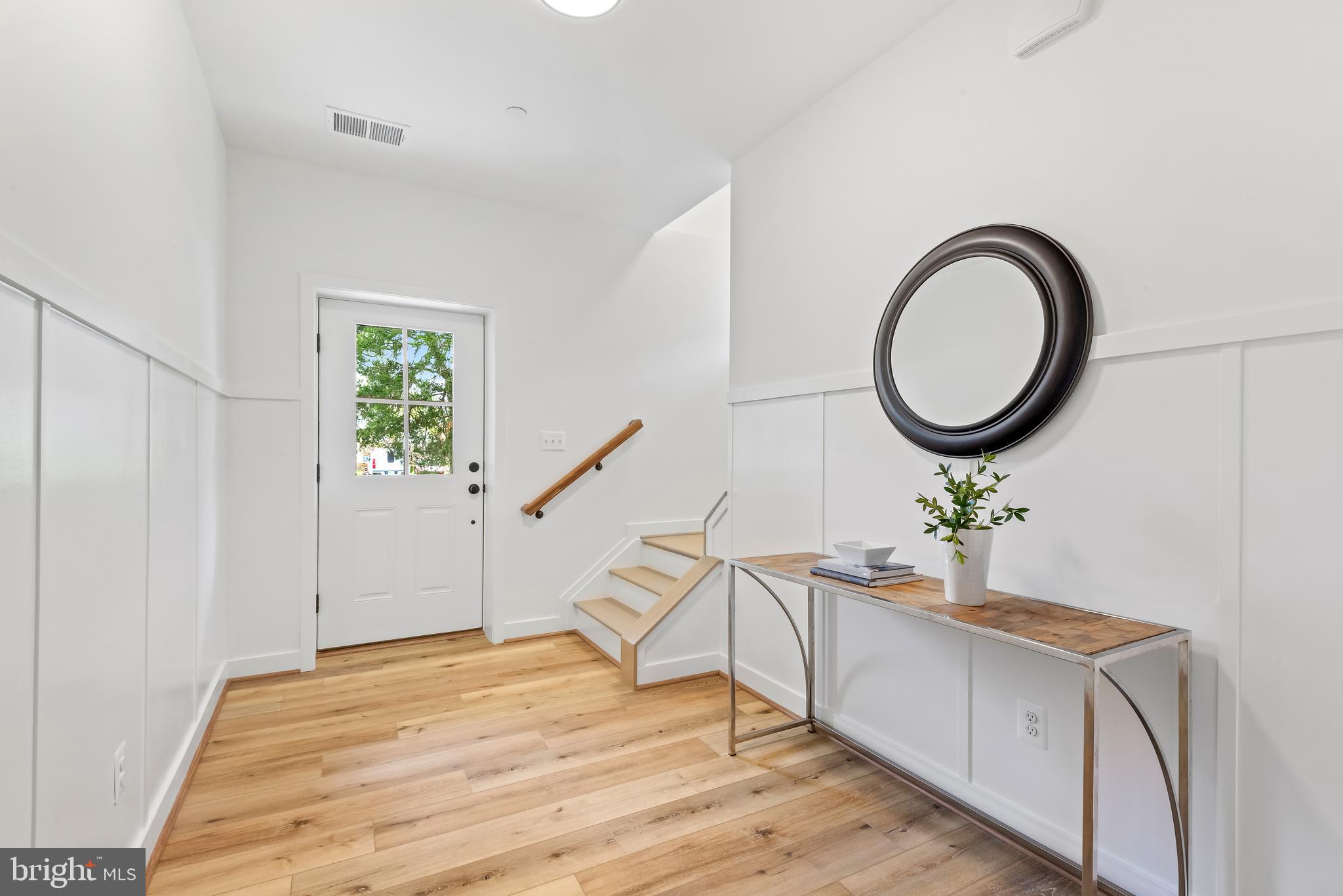 6016 Drum Point Road Deale, MD 20751 - Photo 3 of 42 a bedroom with a bed and a window