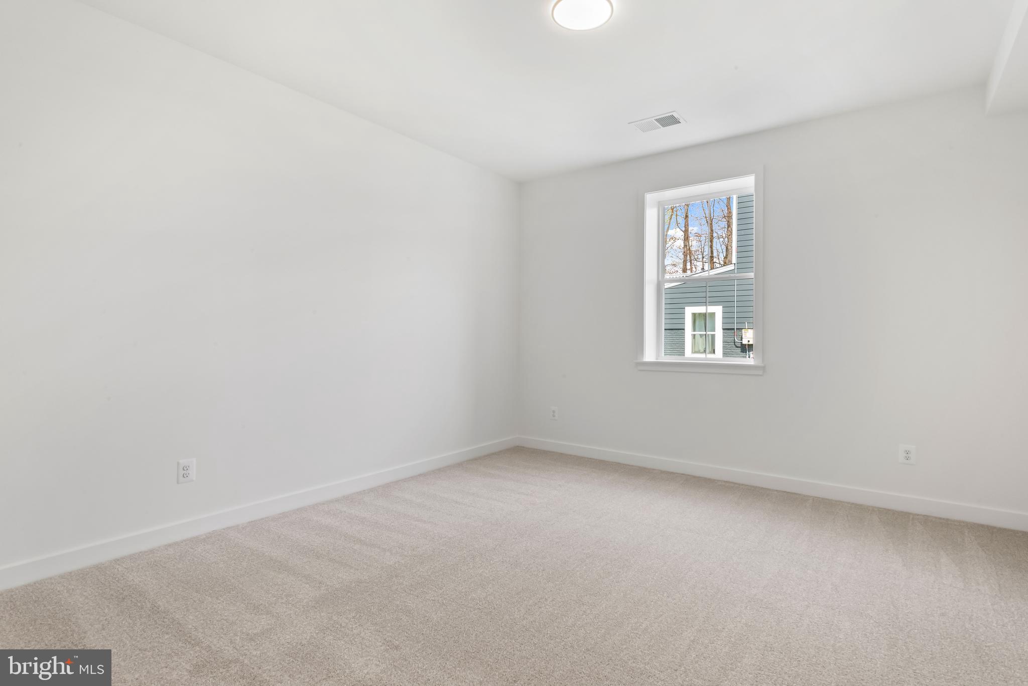 6016 Drum Point Road Deale, MD 20751 - Photo 31 of 42 an empty room with a window