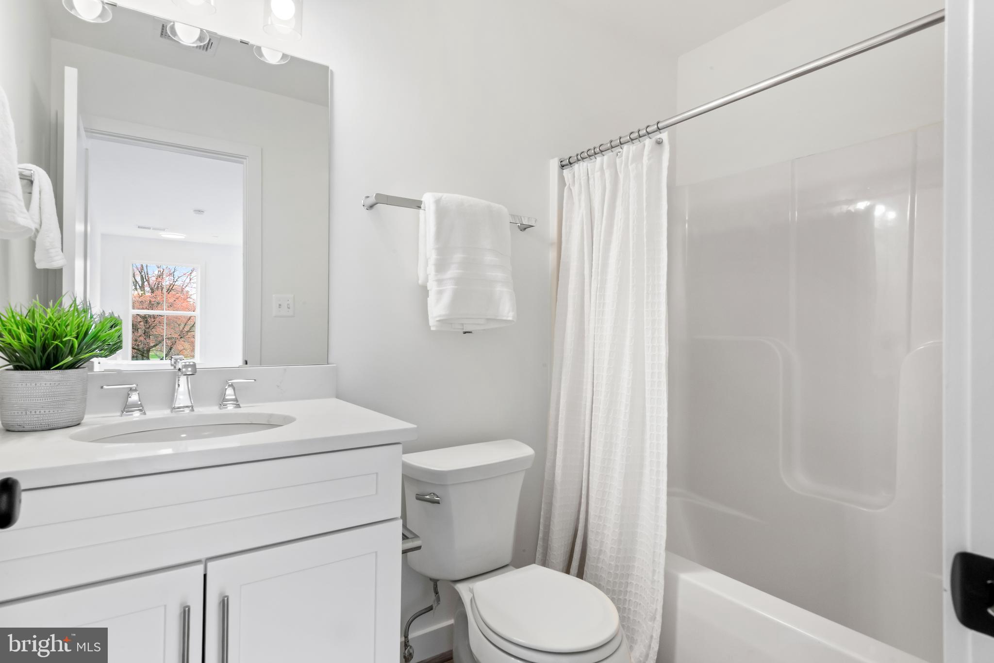 6016 Drum Point Road Deale, MD 20751 - Photo 33 of 42 a bathroom with a sink toilet and shower