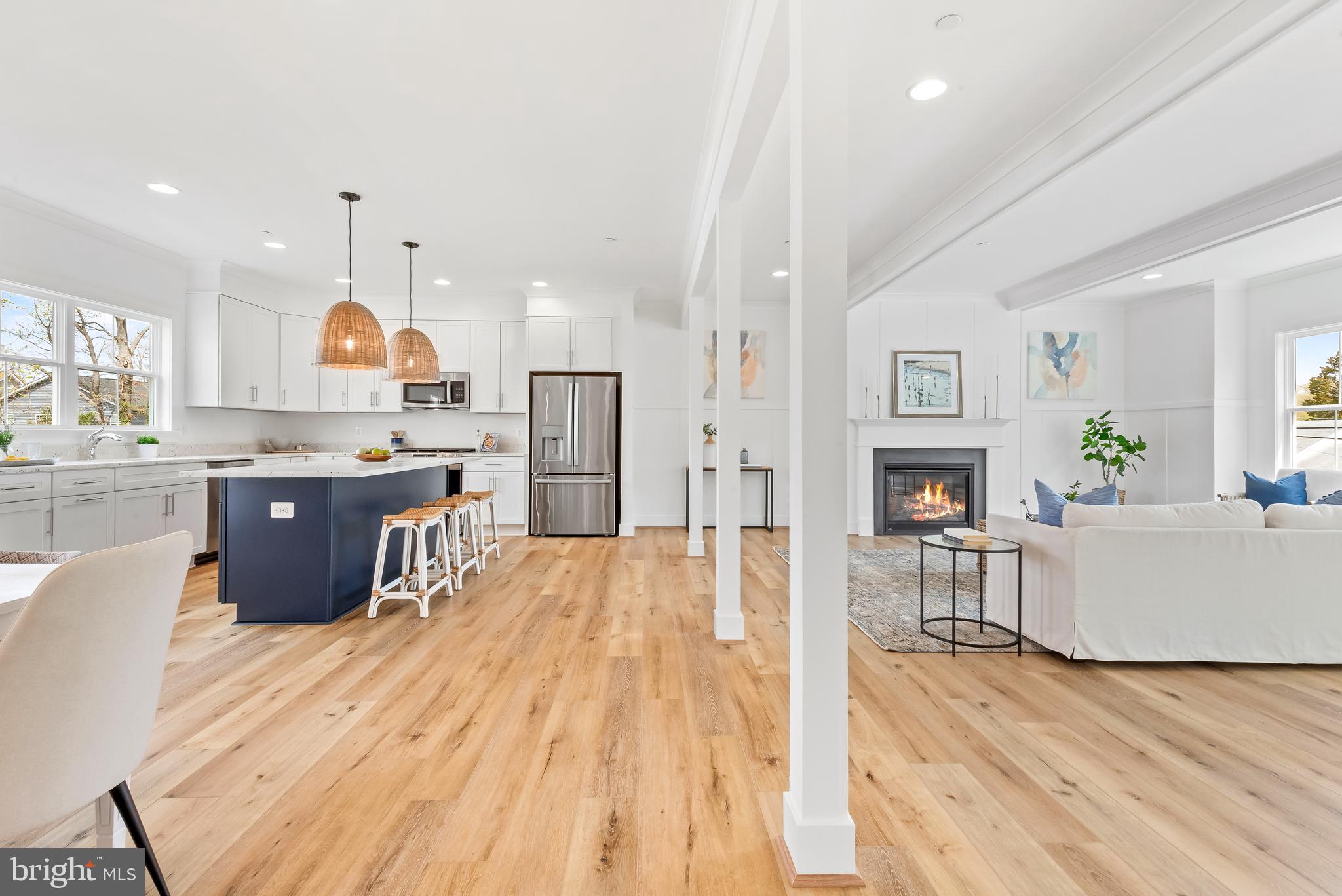 6016 Drum Point Road Deale, MD 20751 - Photo 4 of 42 a large kitchen with stainless steel appliances kitchen island a large counter top and a wooden floors