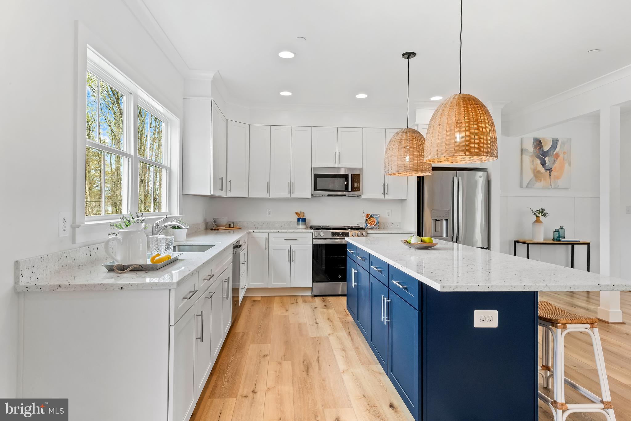 6016 Drum Point Road Deale, MD 20751 - Photo 8 of 42 a large kitchen with stainless steel appliances granite countertop a stove a sink dishwasher and a refrigerator