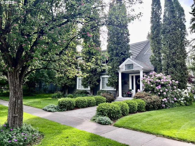 a front view of a house with garden
