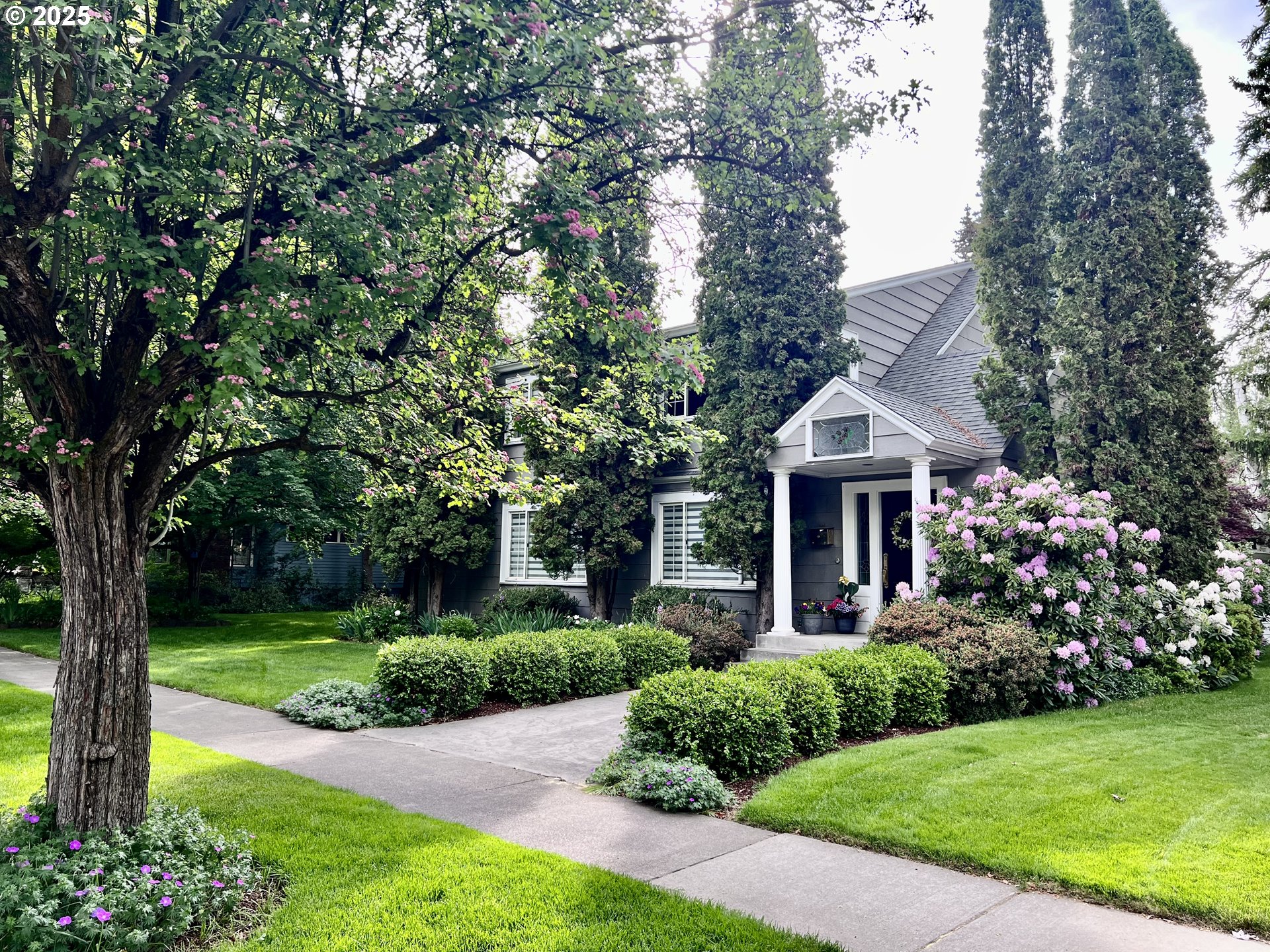 a front view of a house with garden