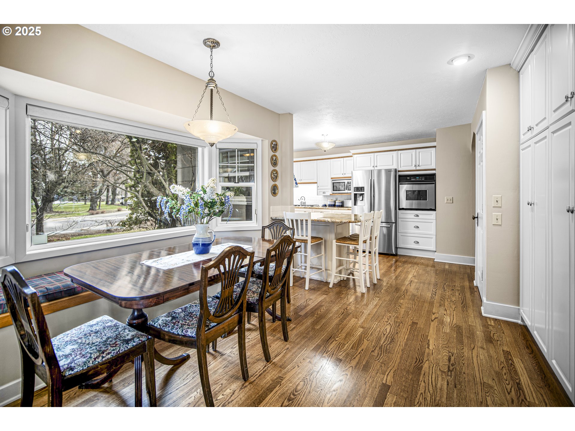 898 Northwest Riverside Boulevard Bend, OR 97703 - Photo 12 of 32 a dining room with furniture and wooden floor